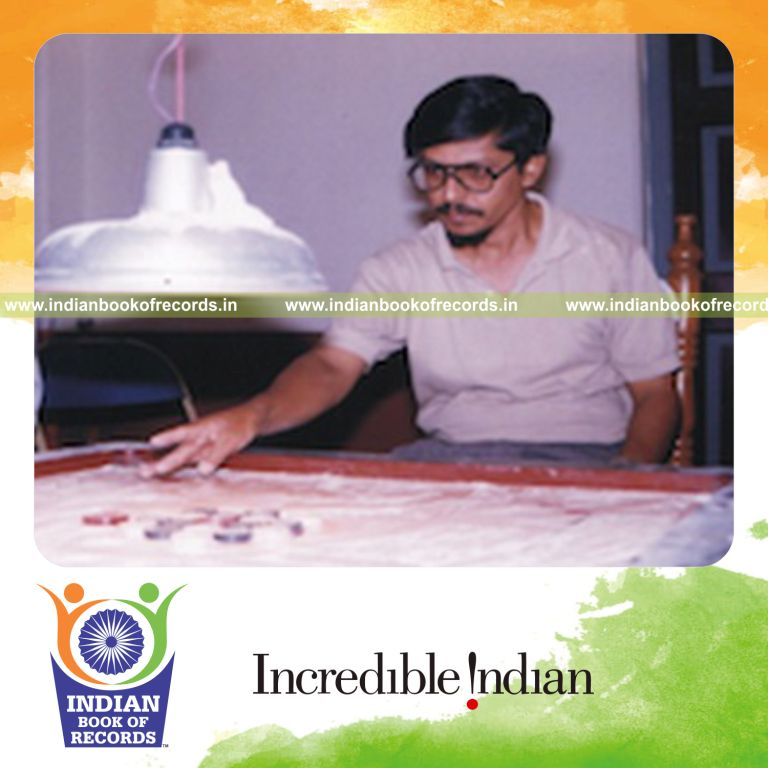 male individual playing extended carrom marathon for record in Indian Book of Records