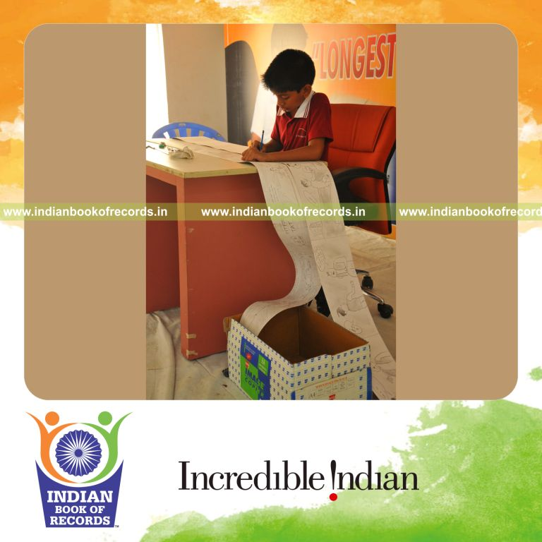 young male creating extended cartoon strip for record in Indian Book of Records