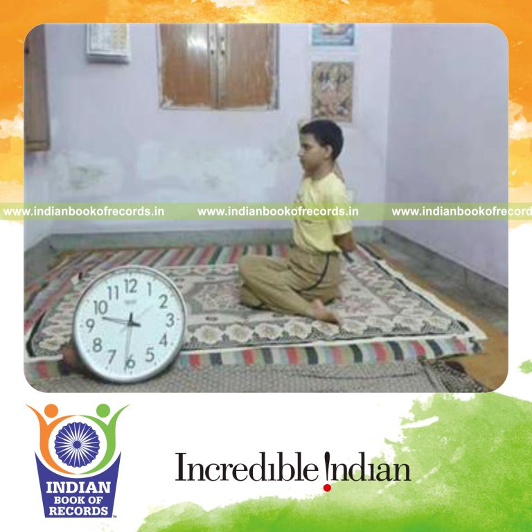 individual holding cow face yoga pose for longest duration for record in Indian Book of Records
