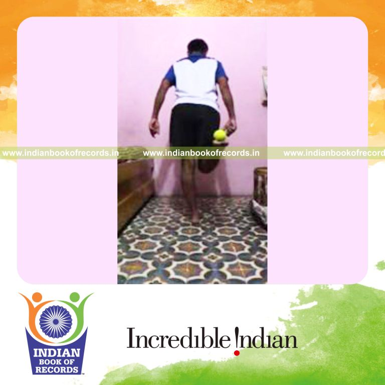 individual balancing cricket ball on sole while standing on one foot for record in Indian Book of Records