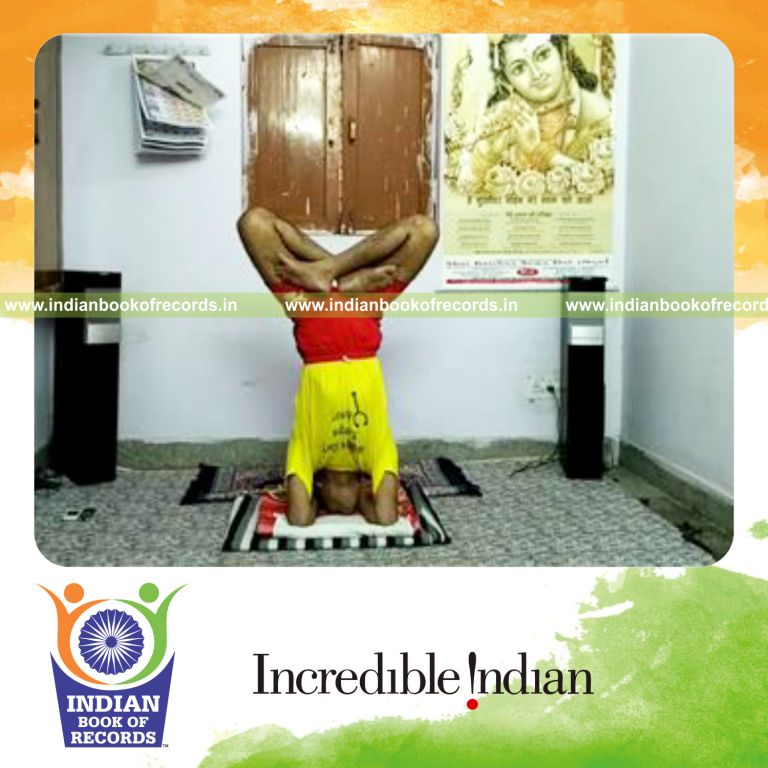 individual performing cross legged headstand for longest duration for record in Indian Book of Records