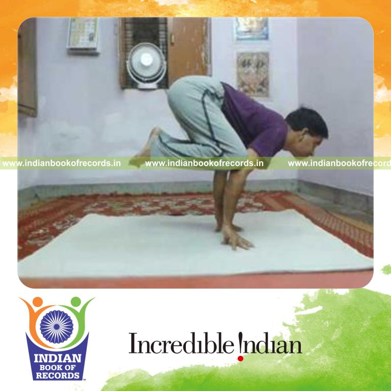 individual holding crow pose on fingers for longest duration for record in Indian Book of Records