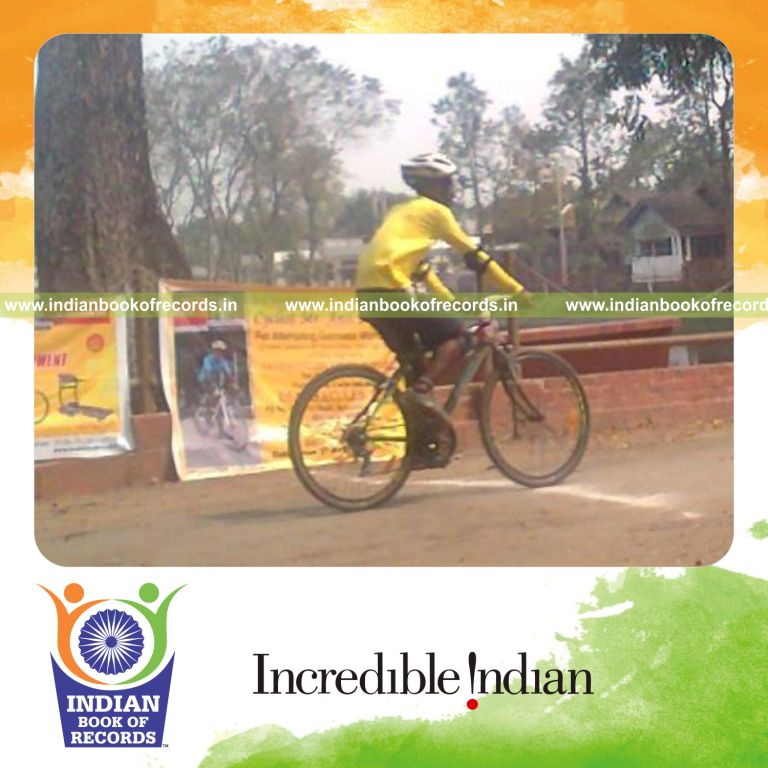 male individual performing extended cycling marathon for an record in Indian Book of Records