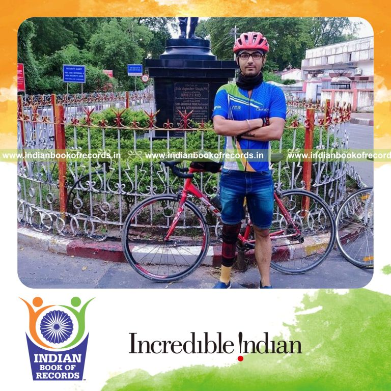 an individual completing a long duration cycling marathon using a prosthetic limb for a record in Indian Book of Records