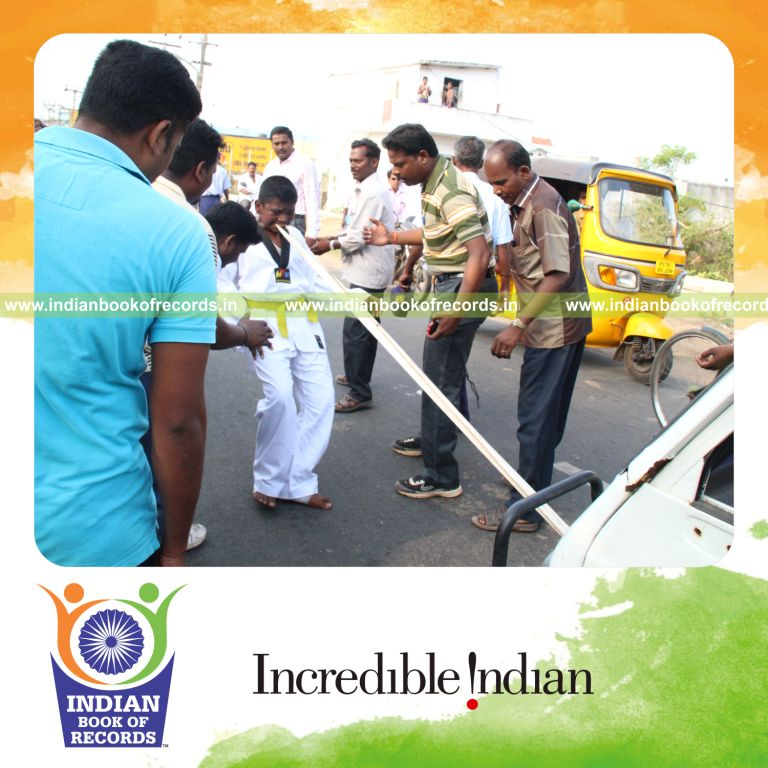 young male pulling car using teeth within thirty minutes for record in Indian Book of Records