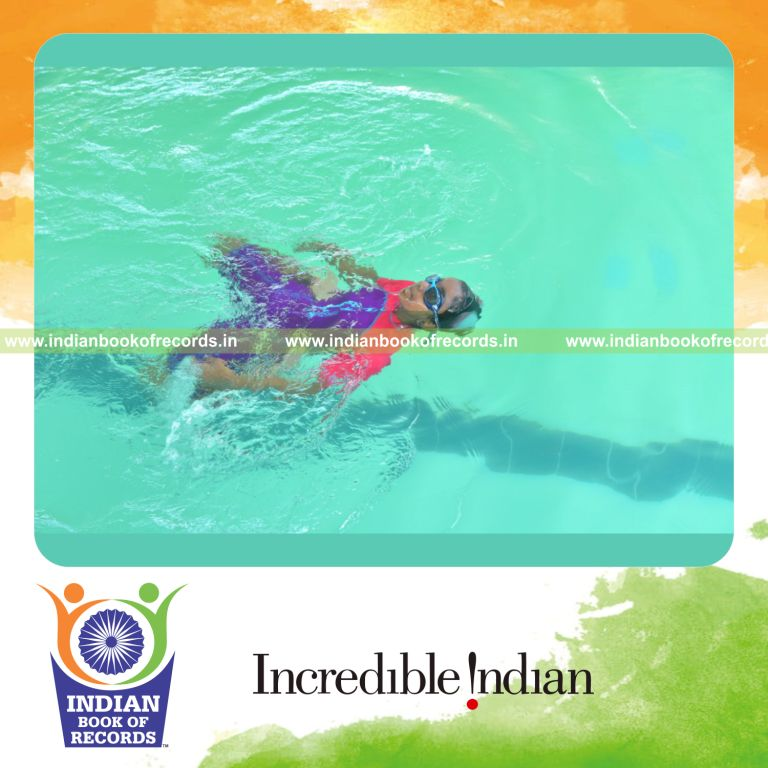 individual minor female swimming longest distance on back with both legs locked for record in Indian Book of Records