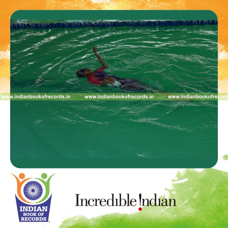 individual minor female swimming longest distance on back with one leg locked for record in Indian Book of Records