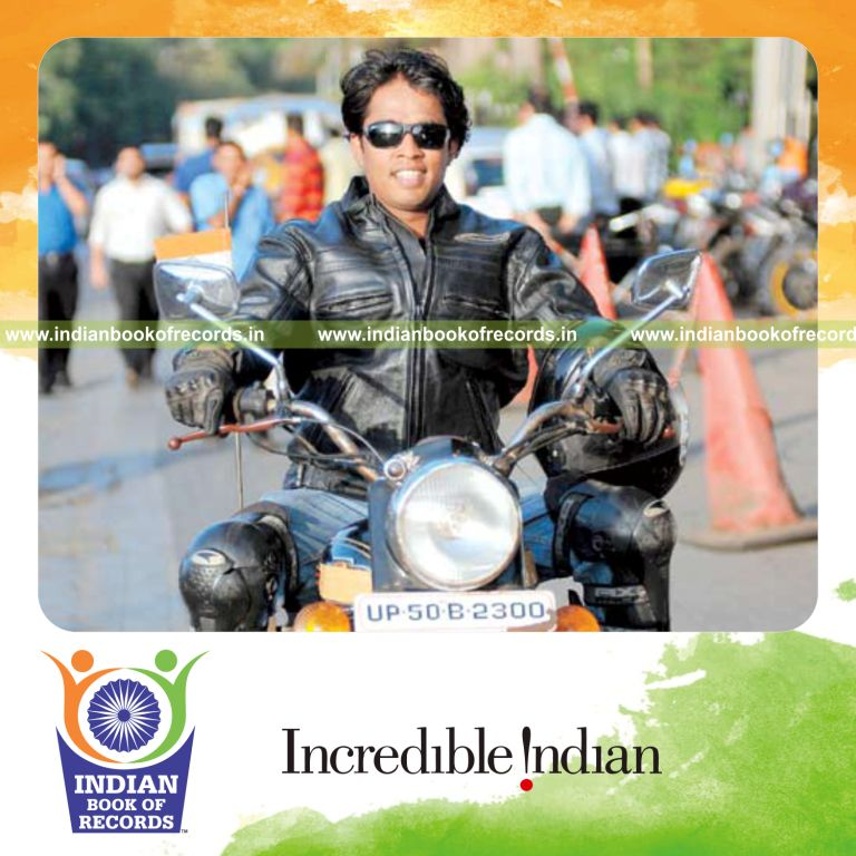 male individual travelling long distance on motor bike in 56 days for record in Indian Book of Records