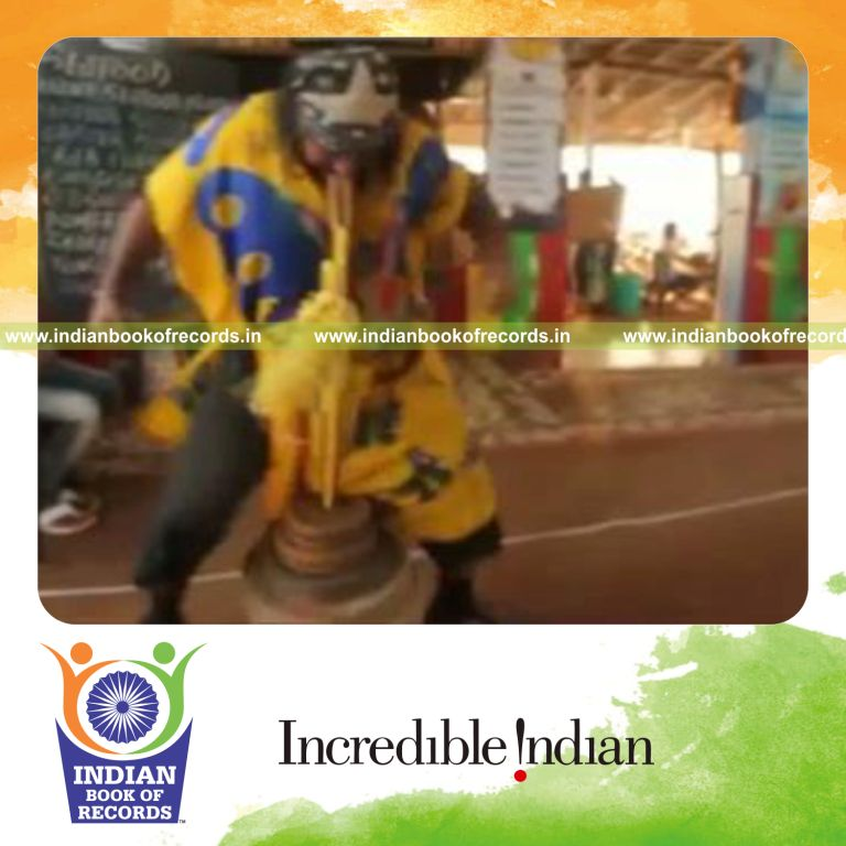 individual walking sideways carrying 90kg in mouth for longest distance for record in Indian Book of Records