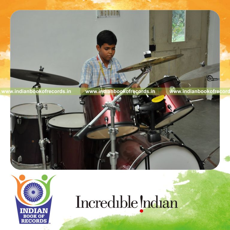 young male performing long drums concert for record in Indian Book of Records