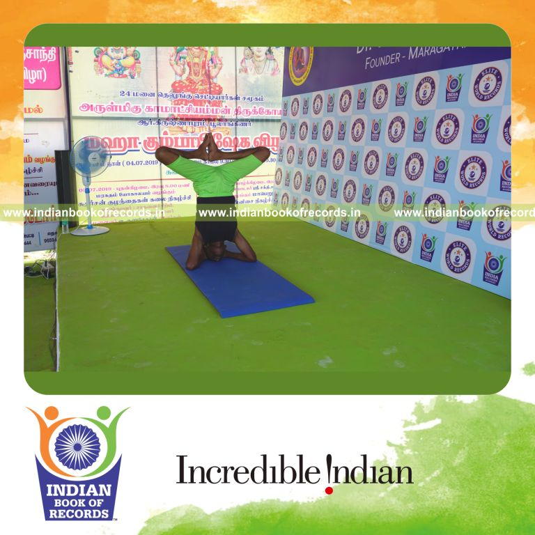 an individual holding the baddha sirsasana yoga pose continuously for the longest duration with stability for a record in Indian Book of Records
