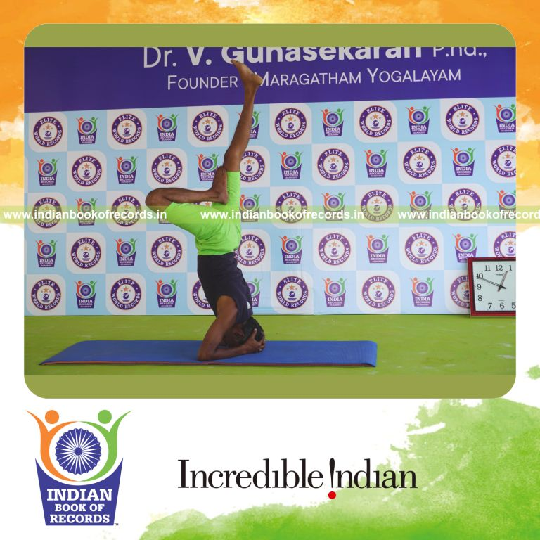 an individual holding the daksina ardha sirsasana yoga pose continuously for the longest duration with control for a record in Indian Book of Records