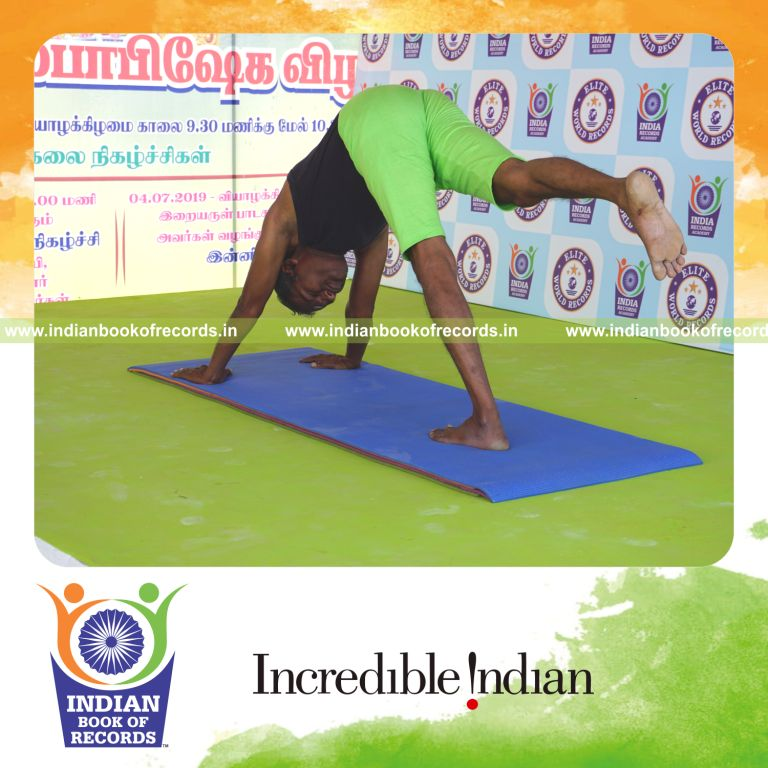 an individual holding daksina ekapada adho mukha svanasana yoga pose for the longest duration with balance and control for a record in Indian Book of Records