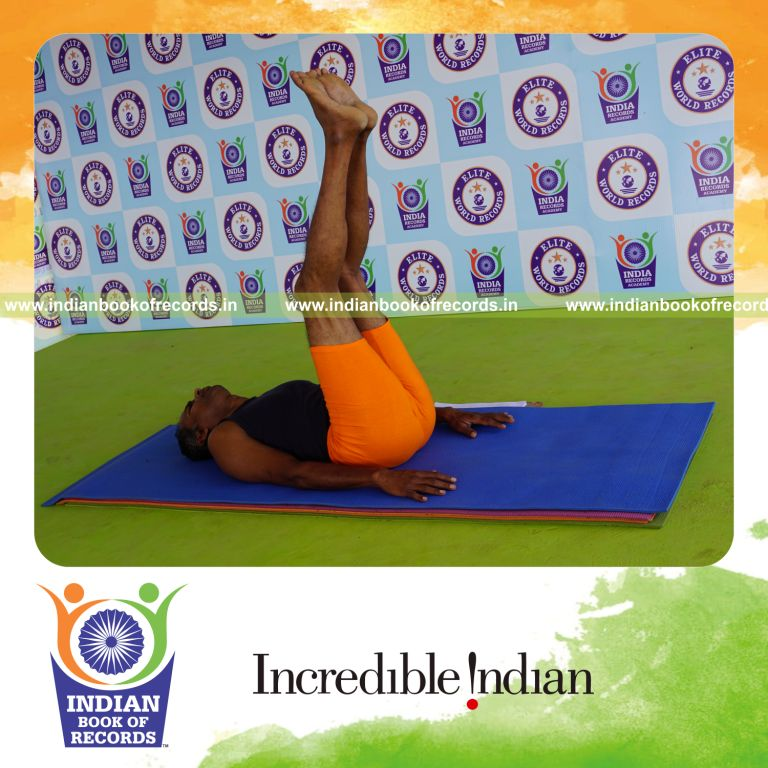 individual holding ardha halasana yoga pose for record in Indian Book of Records