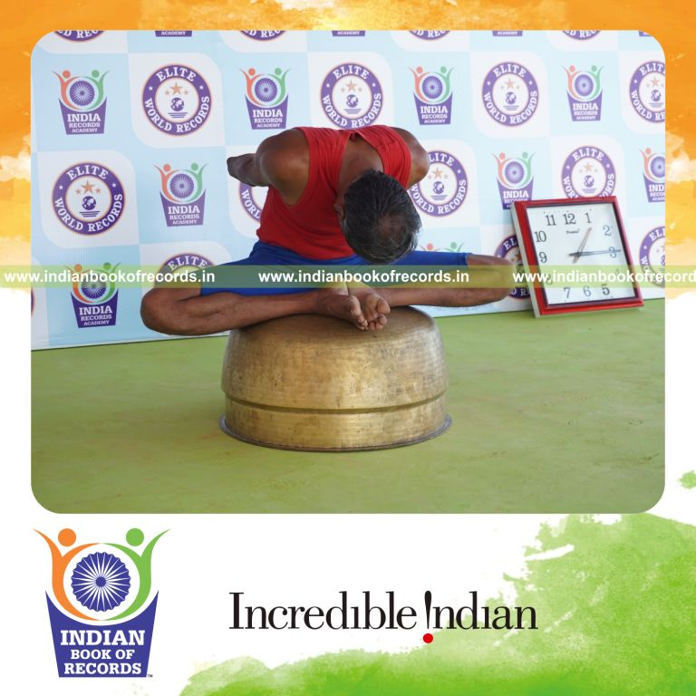 individual holding badha goburasana yoga pose on a vessel for record in Indian Book of Records