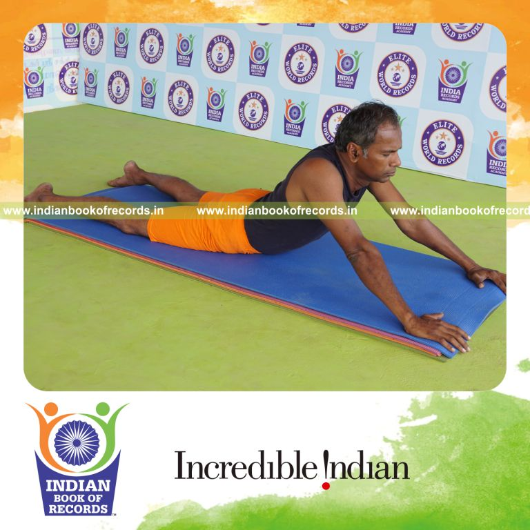 individual holding bhujangasana yoga pose for record in Indian Book of Records