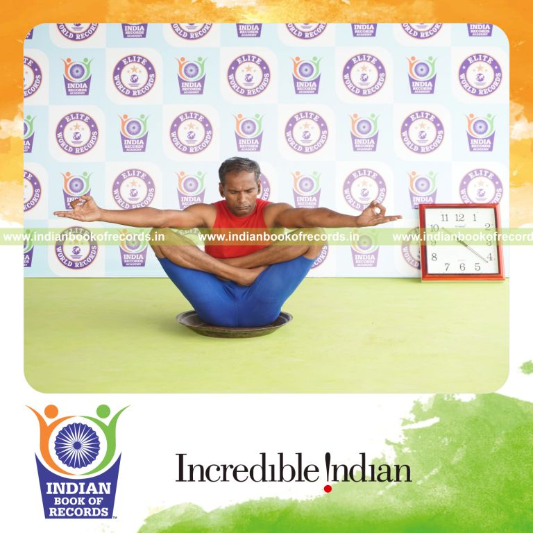 individual holding chinmudra thulangasana yoga pose on a brass plate for record in Indian Book of Records