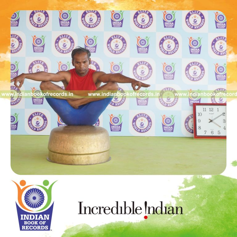 individual holding chinmudra thulangasana yoga pose on a vessel for record in Indian Book of Records