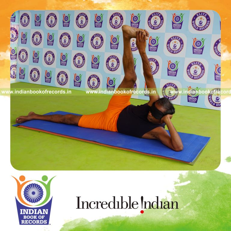 individual holding daksina anandasana yoga pose blindfolded for record in Indian Book of Records