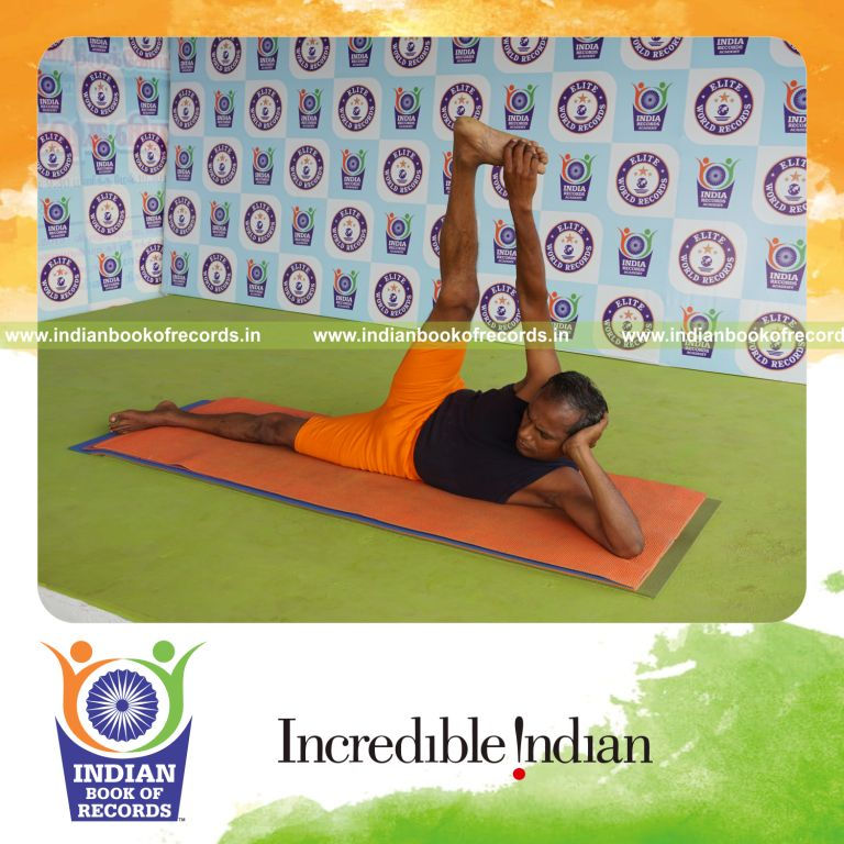 individual holding daksina anandasana yoga pose for record in Indian Book of Records