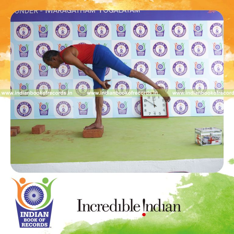 individual holding daksina ardha chandra virabhadrasana yoga pose on bricks for record in Indian Book of Records