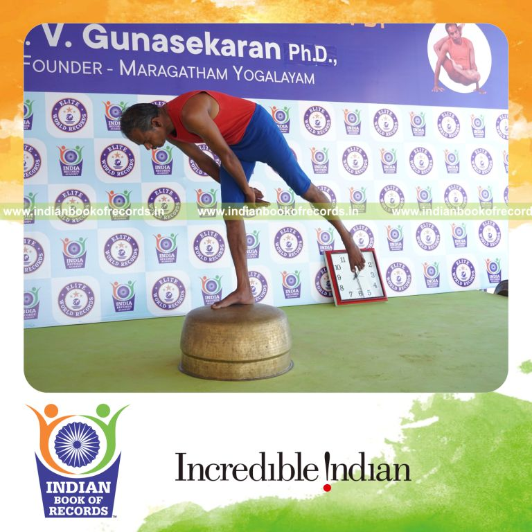 individual holding daksina ardha chandra virabhadrasana yoga pose on a vessel for record in Indian Book of Records