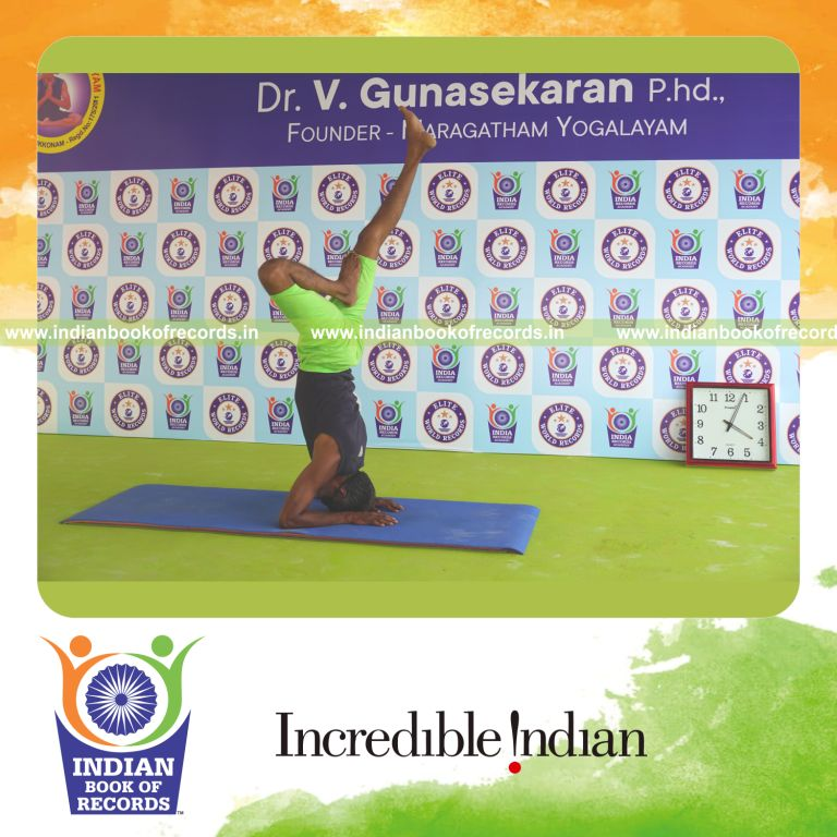an individual holding daksina ardha salamba sirsasana yoga pose blindfolded continuously for the longest duration with stability and control for a record in Indian Book of Records