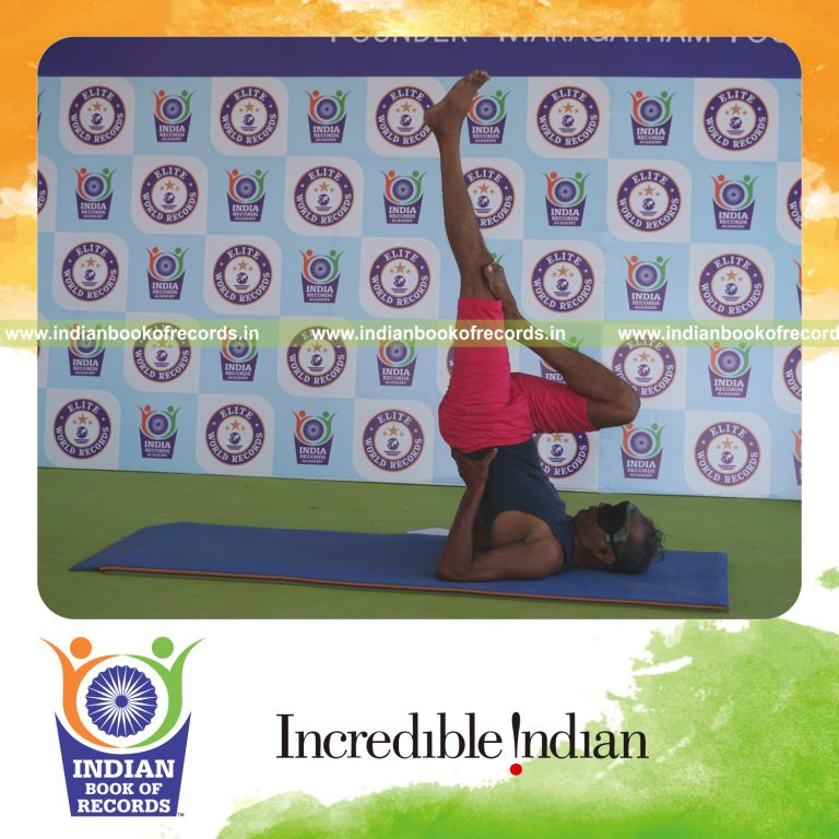 an individual holding daksina ardha sarvangasana yoga pose blindfolded for the longest duration with balance and stability for a record in Indian Book of Records