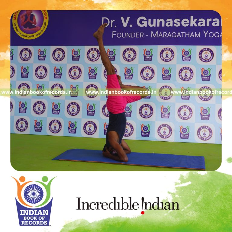 an individual holding daksina ardha sirsasana yoga pose blindfolded for the longest duration with balance and control for a record in Indian Book of Records