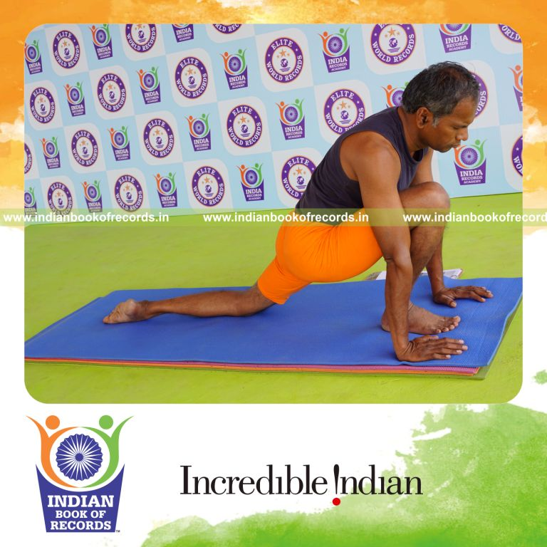 individual holding daksina asva chanjalanasana yoga pose for record in Indian Book of Records