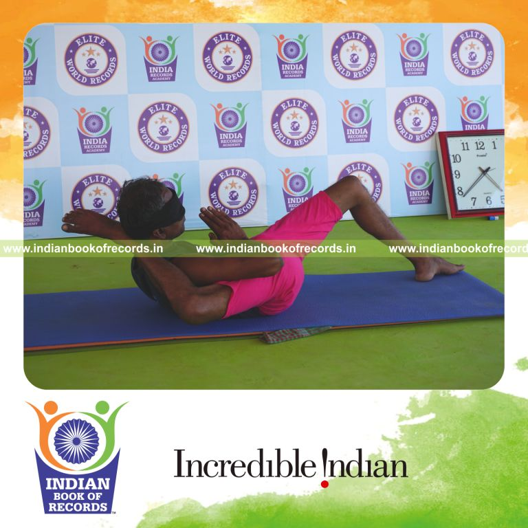 an individual holding daksina bhairavasana yoga pose blindfolded for the longest duration with flexibility and balance for a record in Indian Book of Records