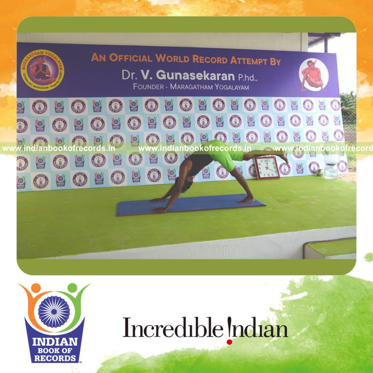 an individual holding daksina ekapada adho mukha svanasana yoga pose blindfolded continuously for the longest duration with balance and control for a record in Indian Book of Records
