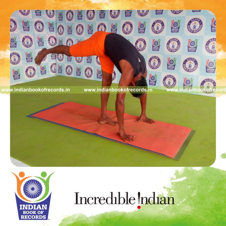 individual holding daksina ekapada padahasthasana yoga pose for record in Indian Book of Records