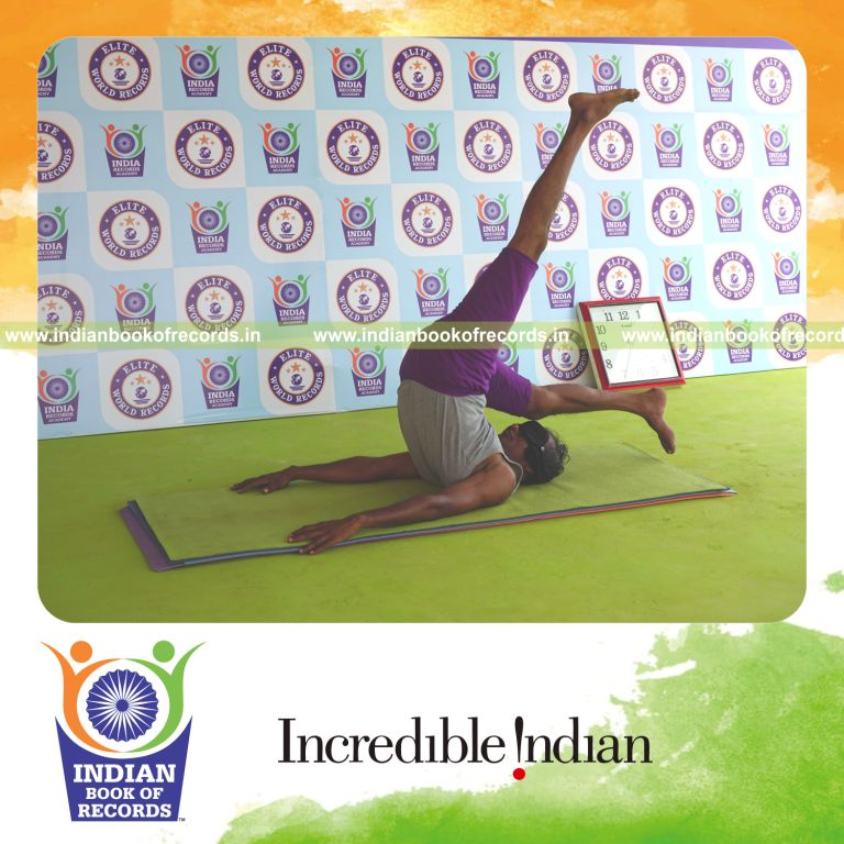 individual holding daksina ekapada salamba sarvangasana yoga pose blindfolded for record in Indian Book of Records