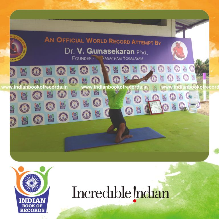 an individual holding daksina ekapada salamba sirsasana yoga pose blindfolded for the longest duration with balance and strength for a record in Indian Book of Records