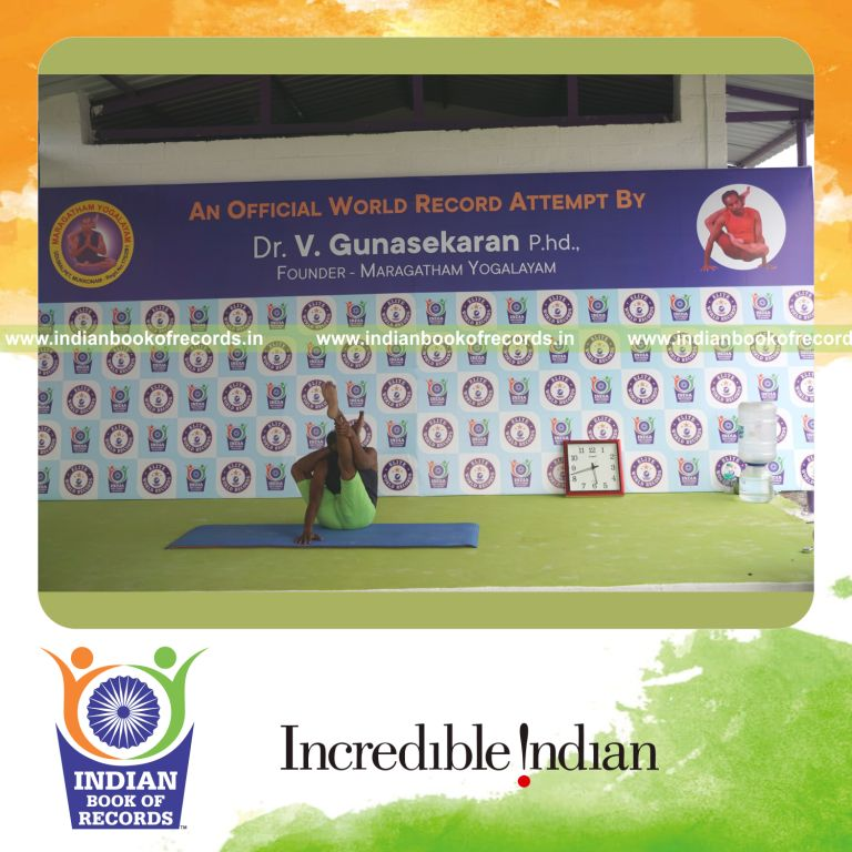 an individual holding daksina ekapada sirasa krounchasana yoga pose blindfolded for the longest duration with control and flexibility for a record in Indian Book of Records