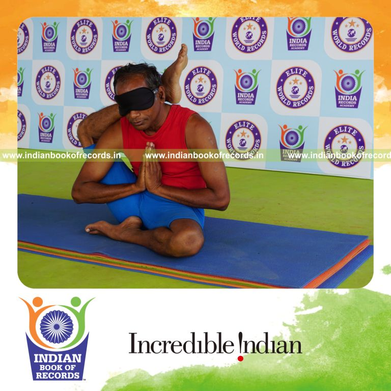 individual holding daksina ekapada sirsasana yoga pose blindfolded for record in Indian Book of Records