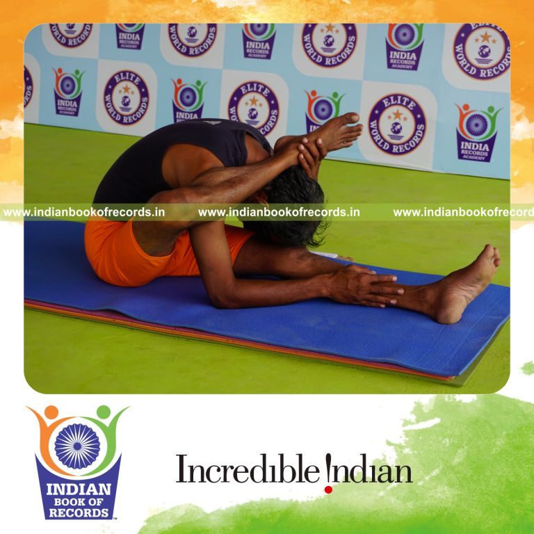 individual holding daksina ekapada skandasana yoga pose blindfolded for record in Indian Book of Records