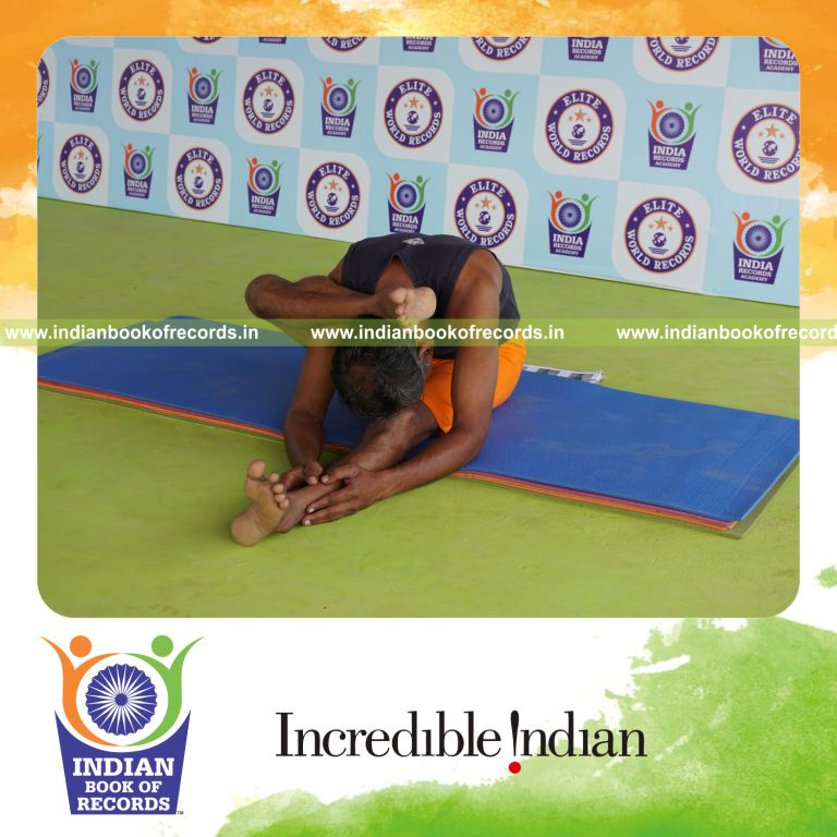 individual holding daksina ekapada skandasana yoga pose for record in Indian Book of Records
