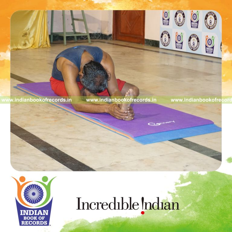 individual holding daksina gomukha janu sirsasana yoga pose for record in Indian Book of Records