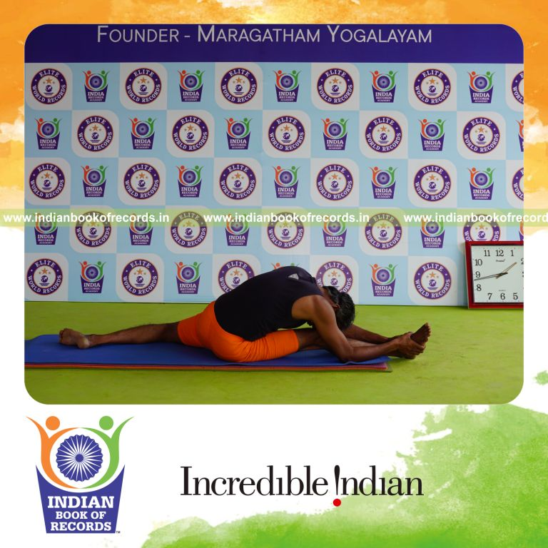 individual holding daksina hanumana paschimottanasana yoga pose blindfolded for record in Indian Book of Records