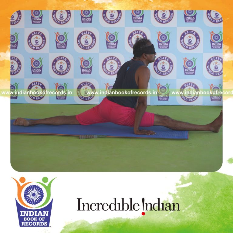 an individual holding daksina hanumanasana yoga pose blindfolded for the longest duration with flexibility and balance for a record in Indian Book of Records