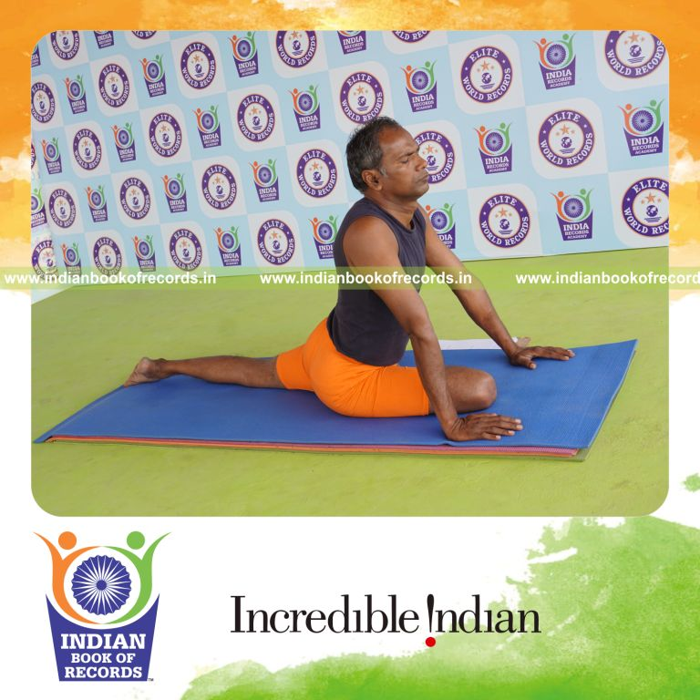 individual holding daksina janu bhujangasana yoga pose for record in Indian Book of Records