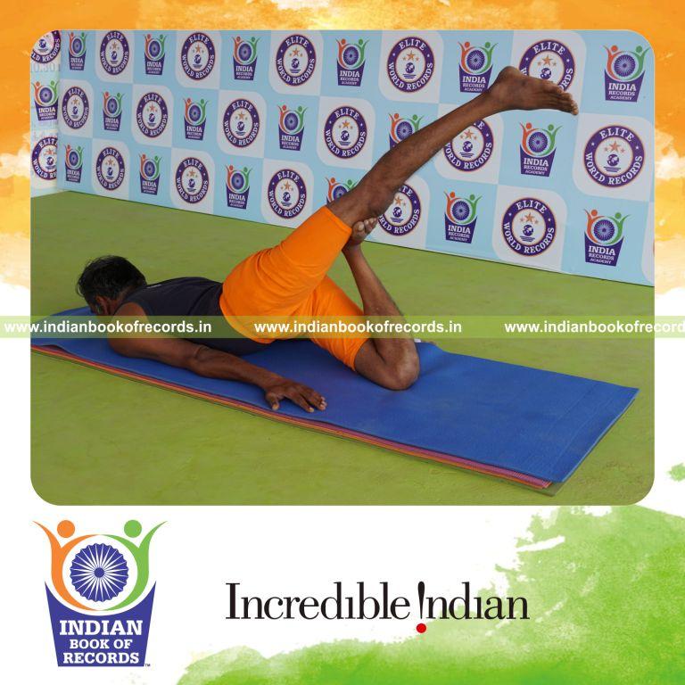 individual holding daksina janu salabhasana yoga pose for record in Indian Book of Records