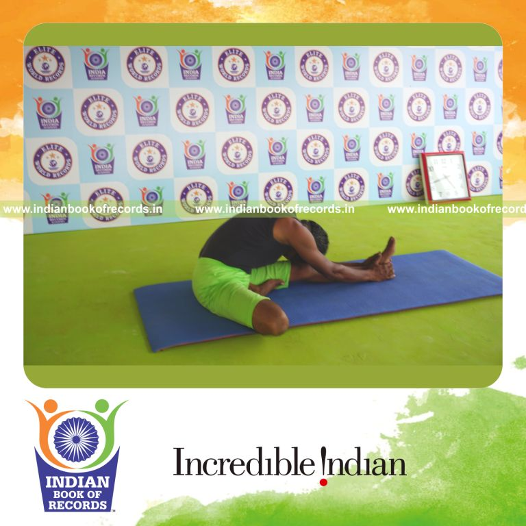 an individual holding daksina janu sirsasana yoga pose blindfolded for the longest duration with flexibility and control for a record in Indian Book of Records