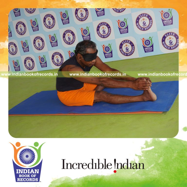 individual holding daksina mahamudra yoga pose blindfolded for record in Indian Book of Records