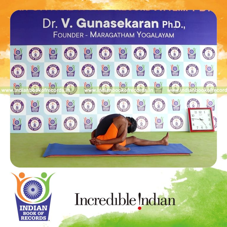 individual holding daksina marichyasana yoga pose blindfolded for record in Indian Book of Records