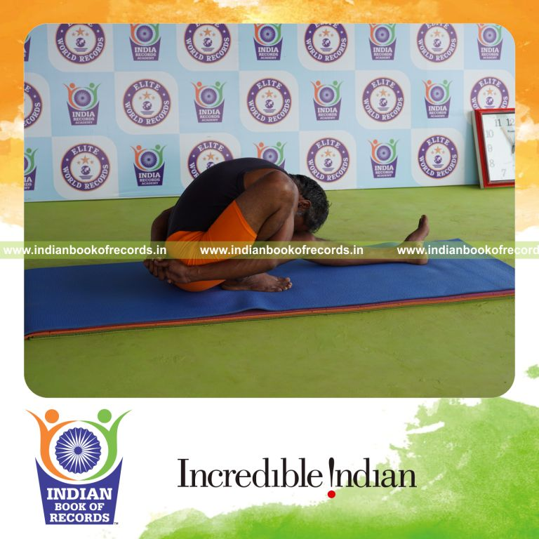 individual holding daksina marichyasana yoga pose for record in Indian Book of Records
