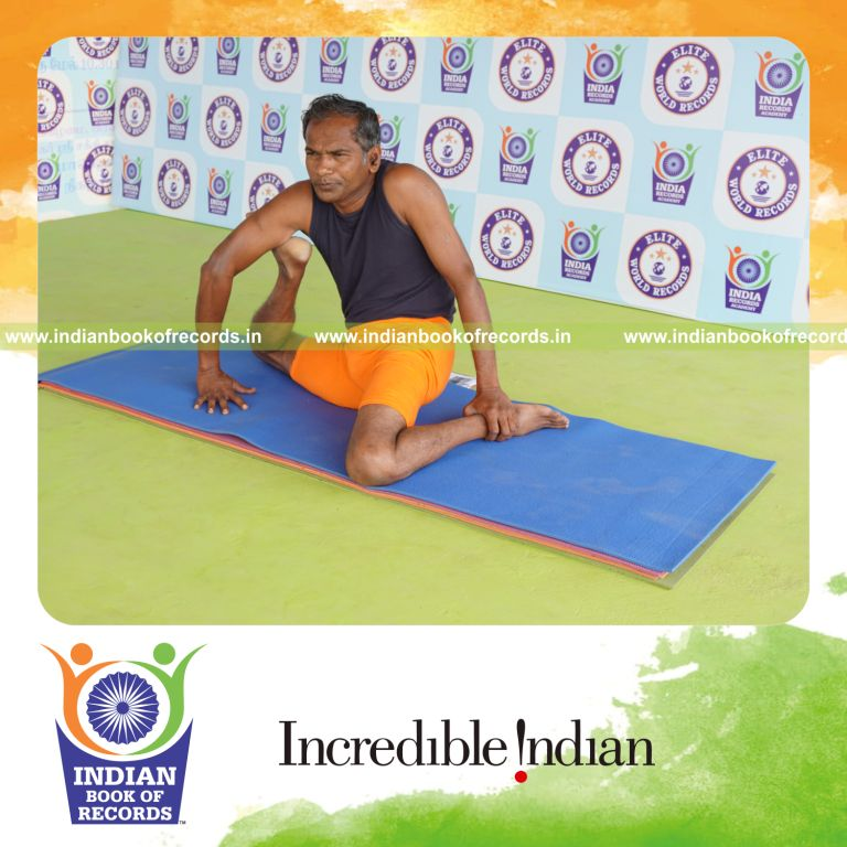 individual holding daksina mrigasana yoga pose for record in Indian Book of Records