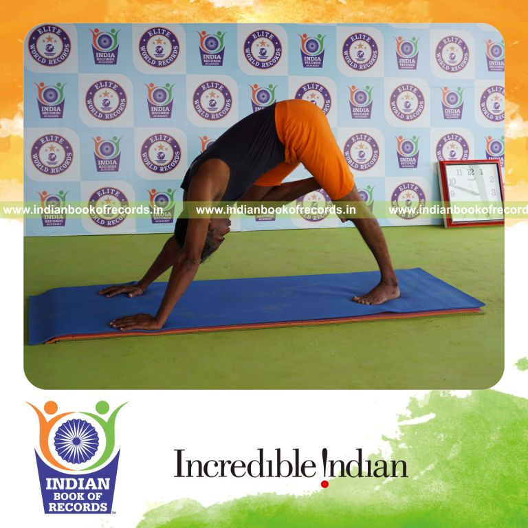 individual holding daksina nasika prusta janu parsavasana yoga pose for record in Indian Book of Records